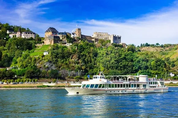 European river cruise sailing past a historic castle